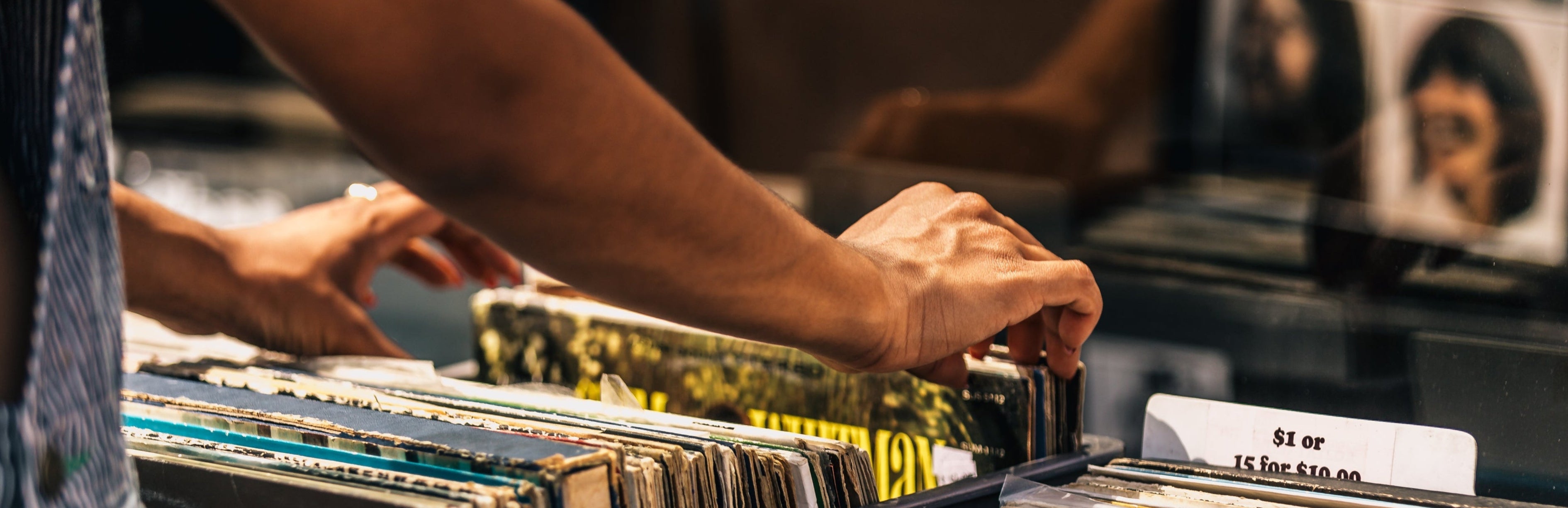 Person browsing through records at a record store